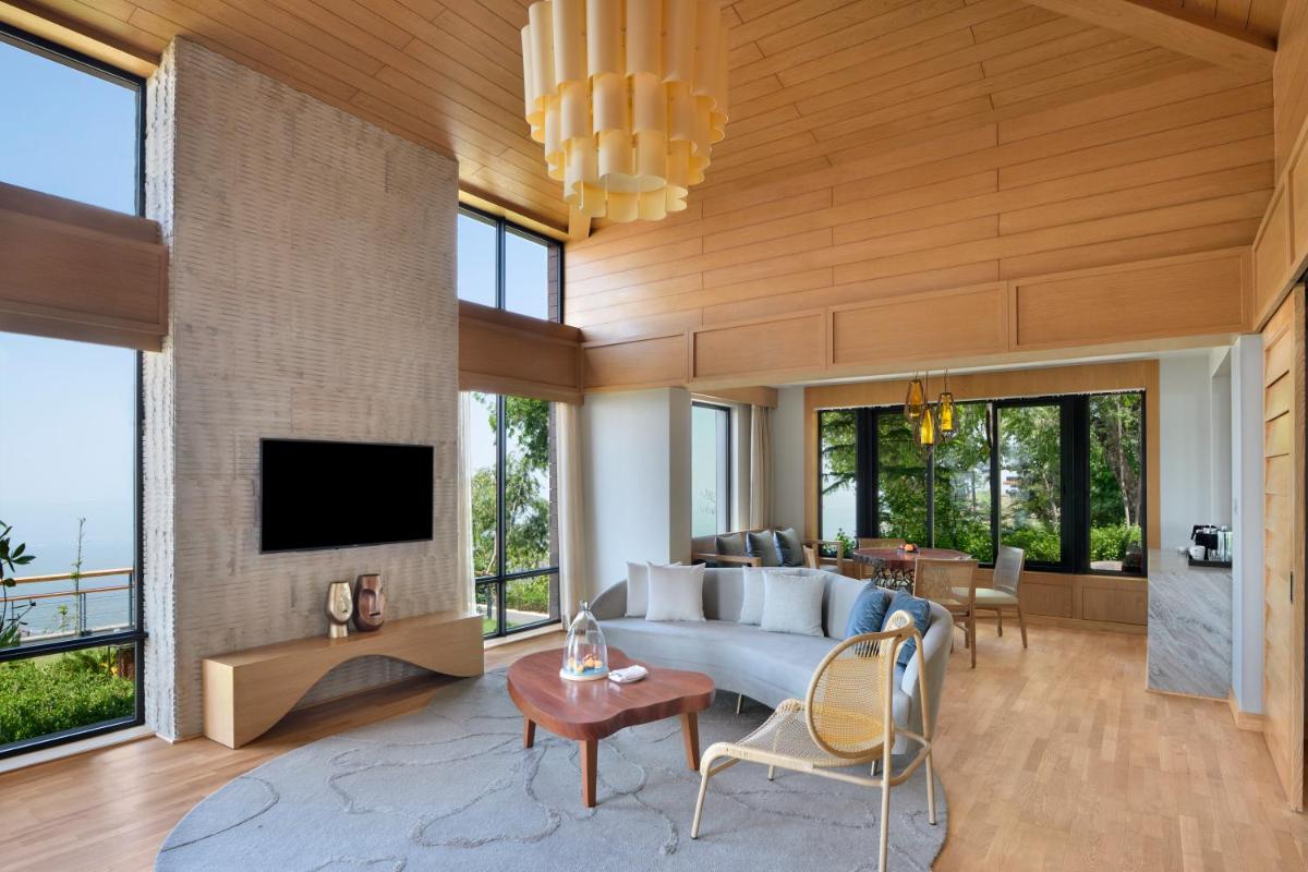 a living room with a couch and a tv at The Westin Resort & Spa Himalayas in Rishīkesh
