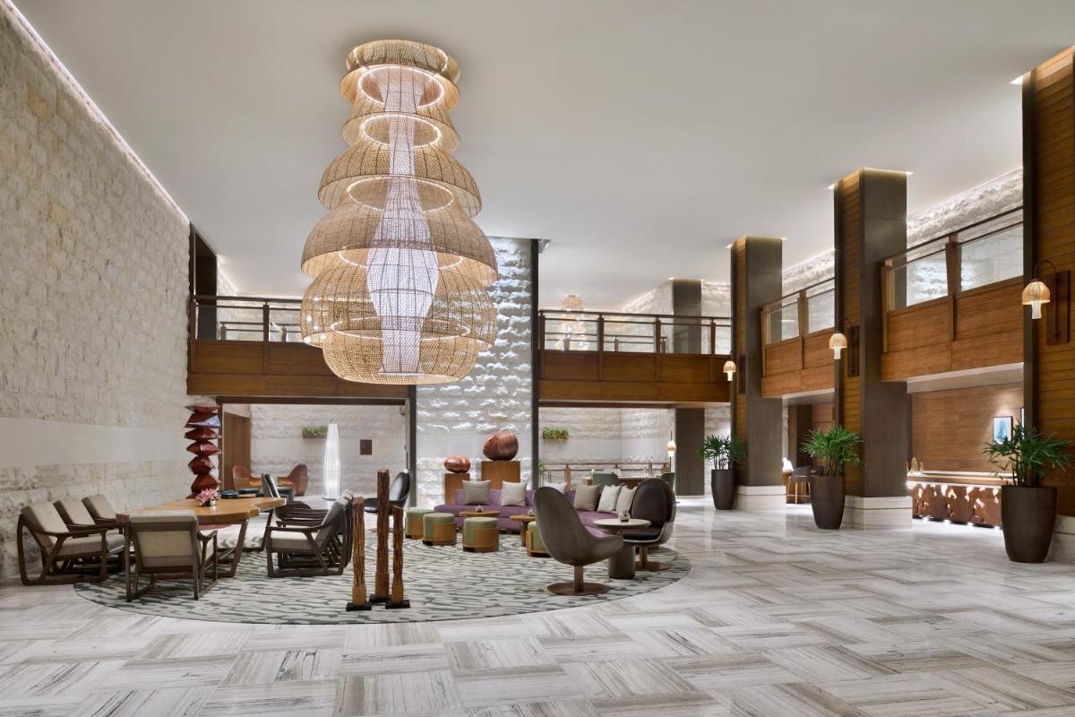 a lobby with a large chandelier in a building at The Westin Resort & Spa Himalayas in Rishīkesh