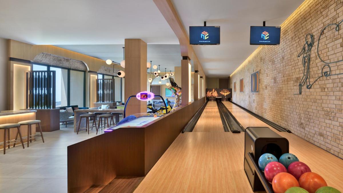 a hallway with a bowling alley in a mall at The Westin Resort & Spa Himalayas in Rishīkesh