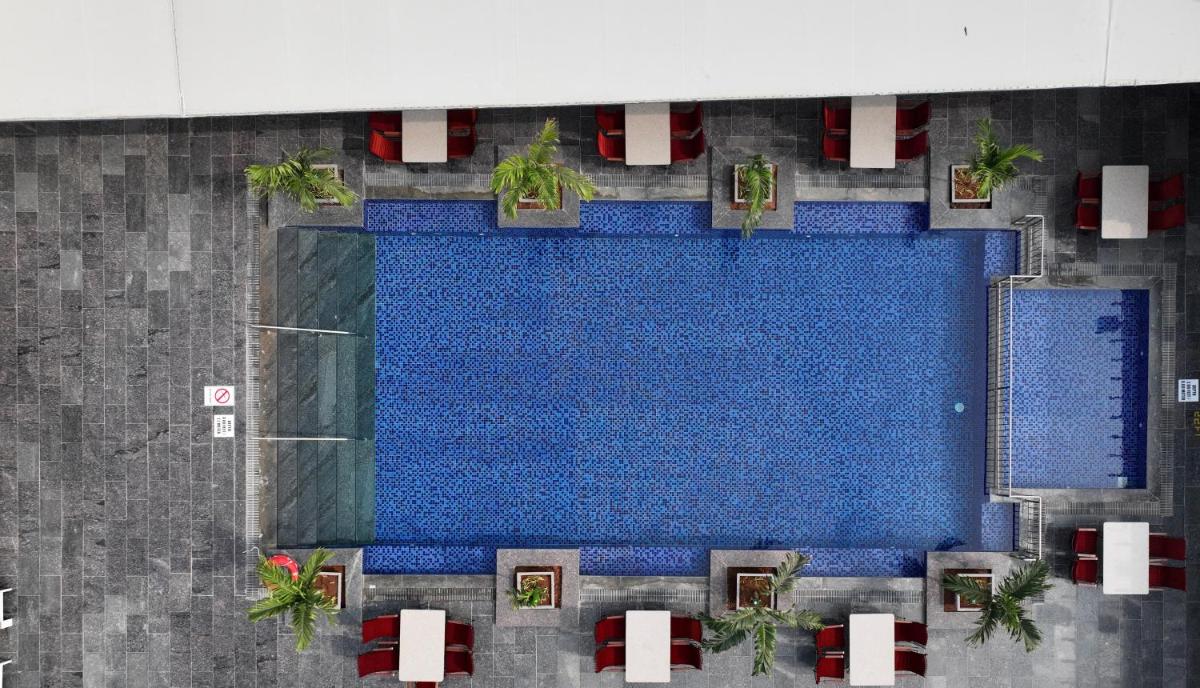 an overhead view of a swimming pool in a building at Le Meridien Hyderabad in Hyderabad