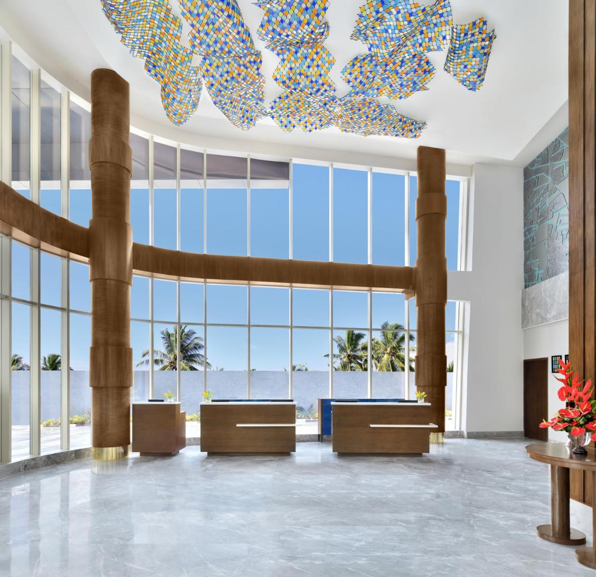 a lobby with a view of the ocean at Le Meridien Hyderabad in Hyderabad