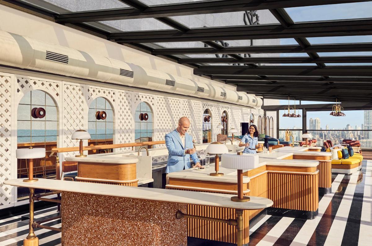 a rendering of a restaurant with people sitting at tables at Four Seasons Hotel Mumbai in Mumbai