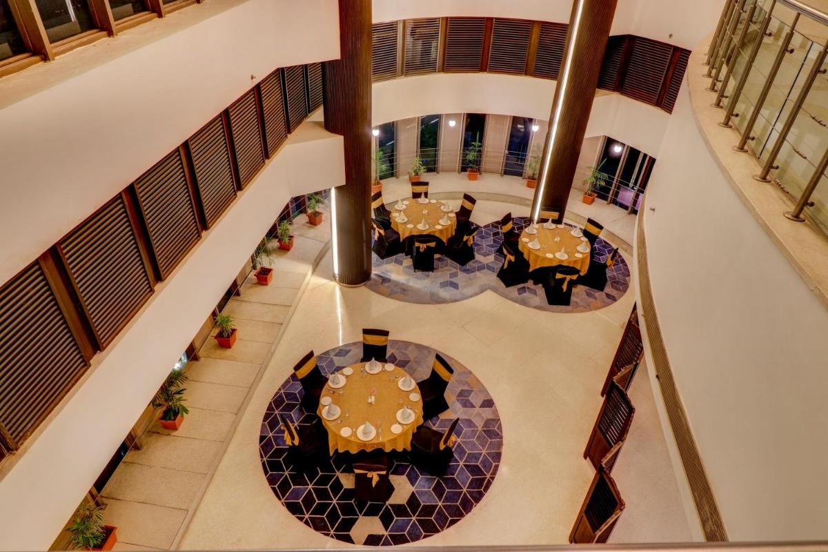 an overhead view of a dining room with a table at Sunday Hotel Jaipur in Jaipur