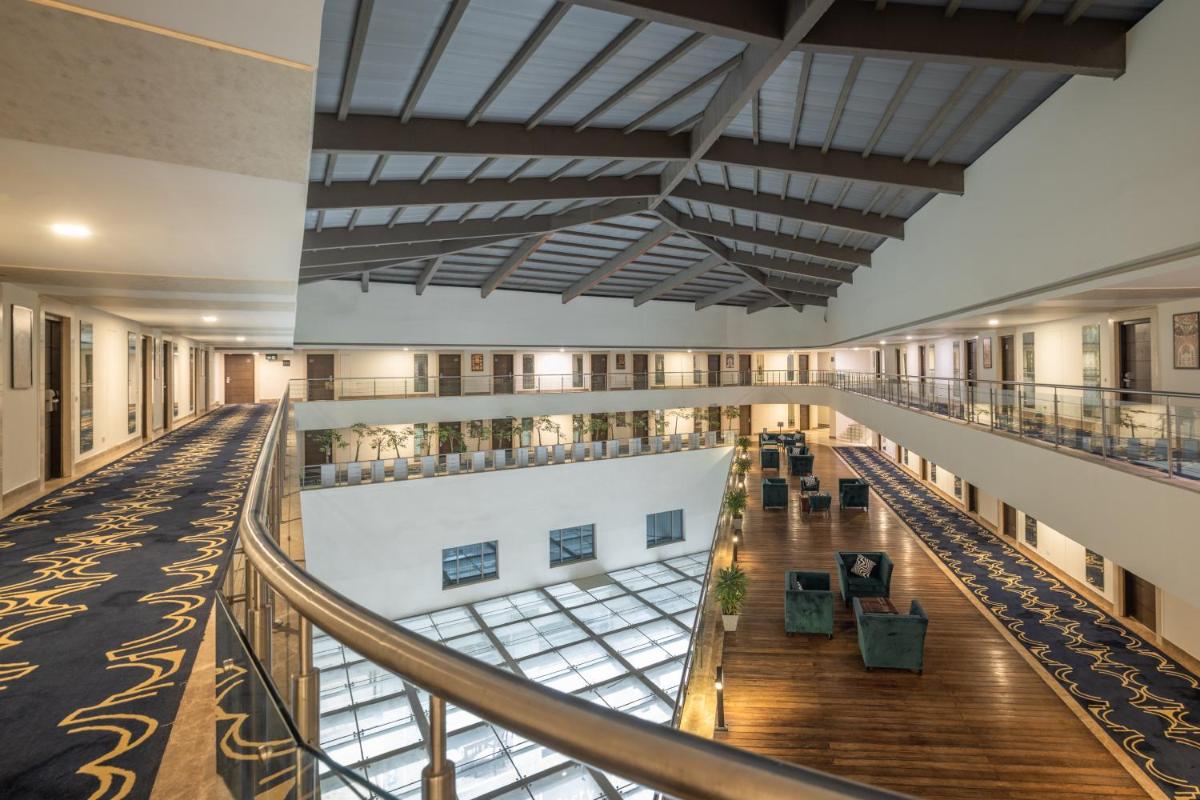 an image of the inside of a building with a lobby at Sunday Hotel Jaipur in Jaipur