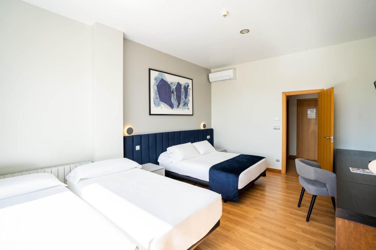 Cama o camas de una habitación en Abba Comillas Hotel