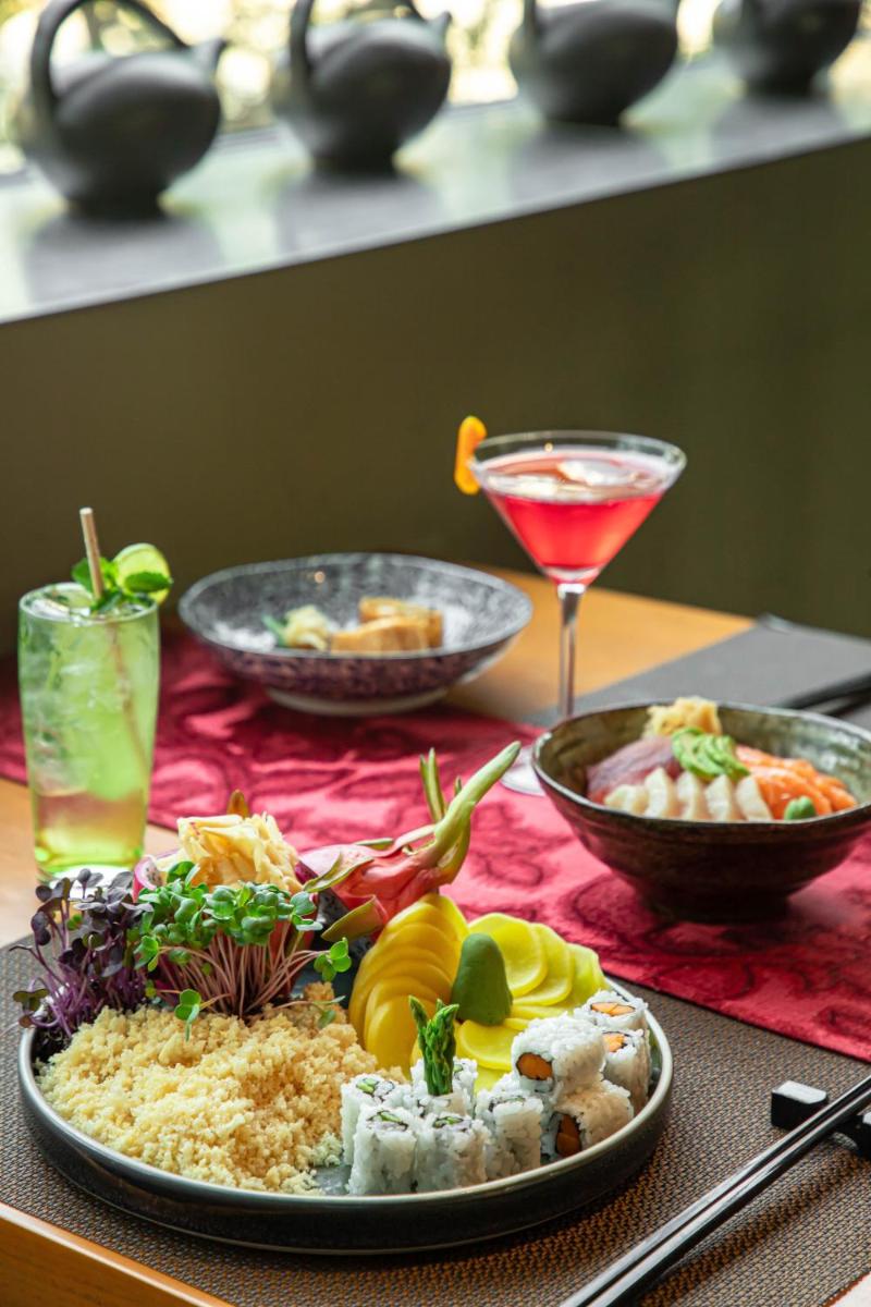 a table with a plate of food on a table at The Westin Gurgaon, New Delhi in Gurgaon
