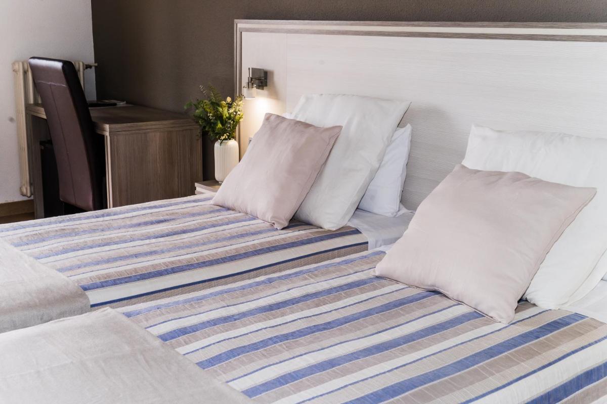Cama o camas de una habitación en Hotel Planas