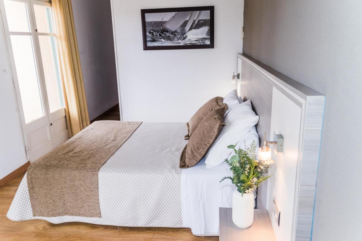 Cama o camas de una habitación en Hotel Planas