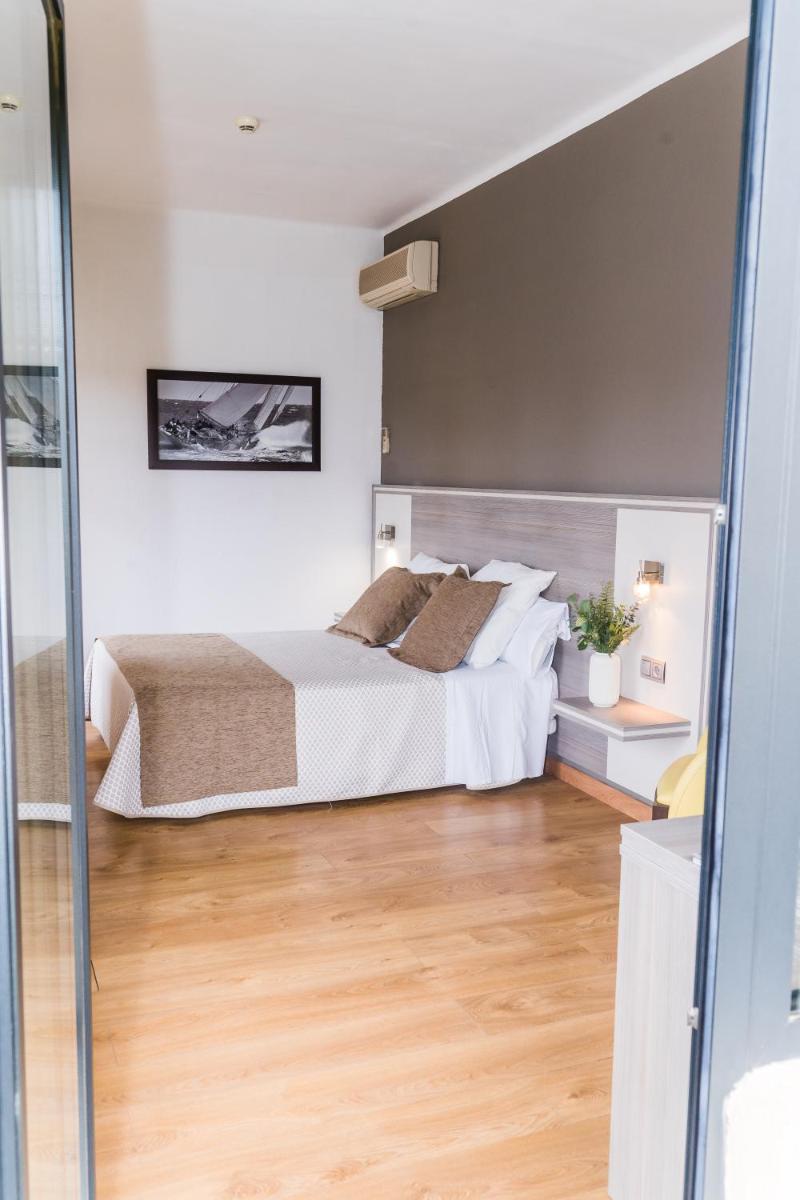 Cama o camas de una habitación en Hotel Planas