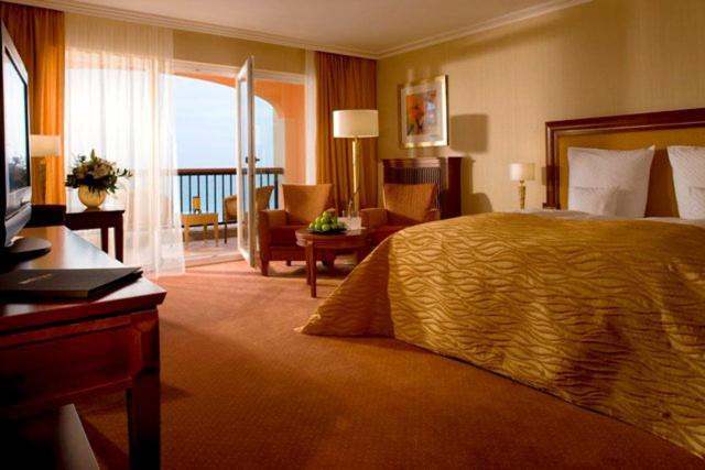 Ein Bett oder Betten in einem Zimmer der Unterkunft Hotel Gran BelVeder & Ostsee Therme Resort & Spa