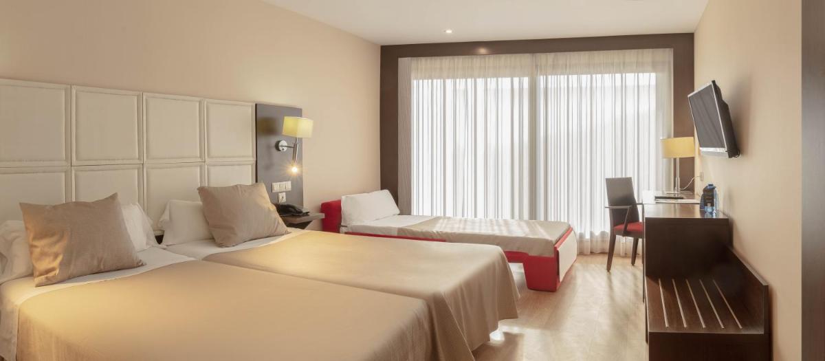 Cama o camas de una habitación en RH Don Carlos & Spa