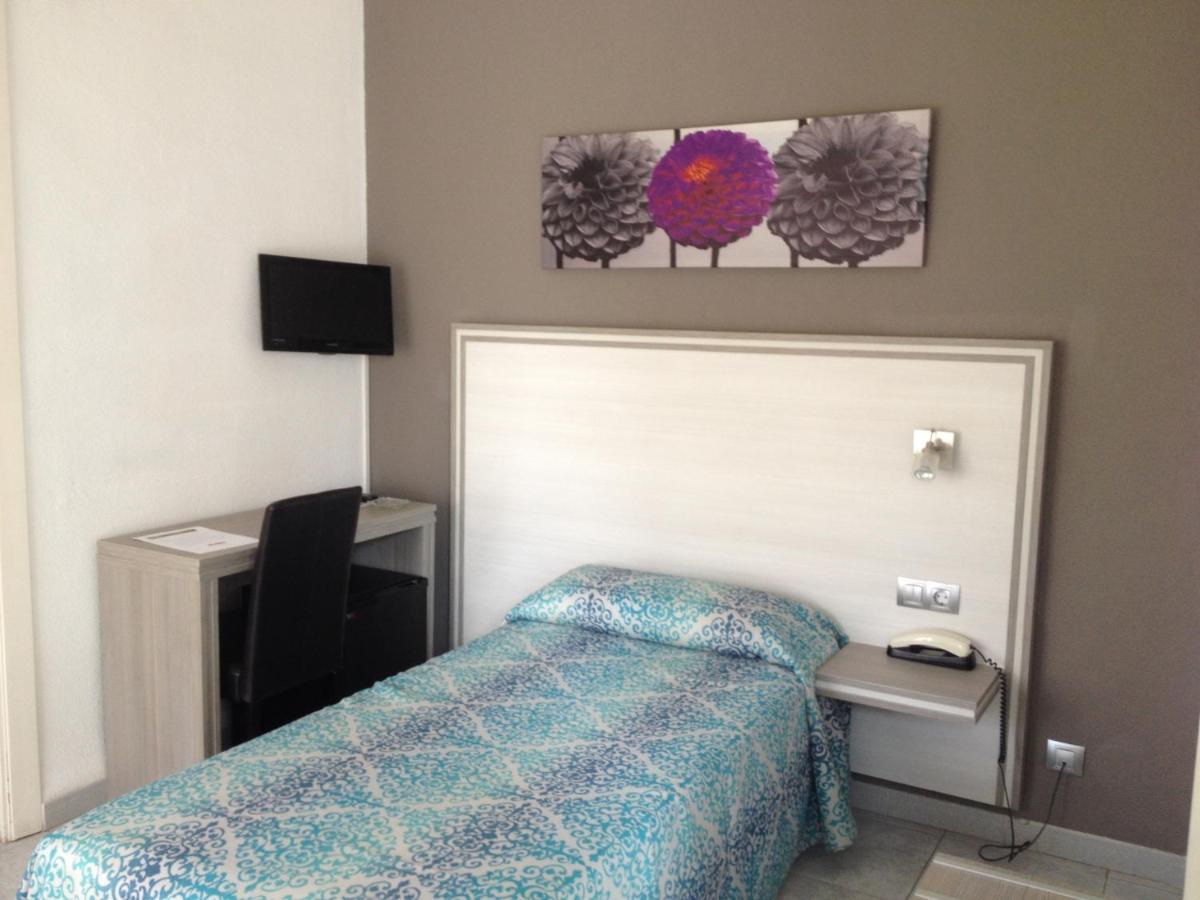 Cama o camas de una habitación en Hotel Planas