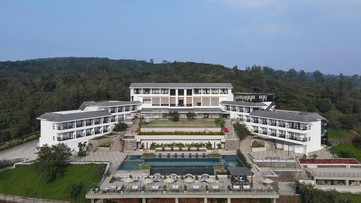 an aerial view of a large building with a garden at Courtyard by Marriott Mahabaleshwar in Mahabaleshwar