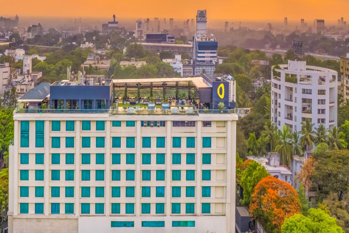 a building with the letter o on the top at O Hotel Pune in Pune