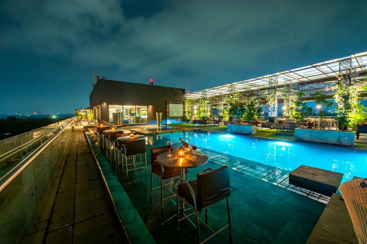 a view of the rooftop of a hotel at night at O Hotel Pune in Pune