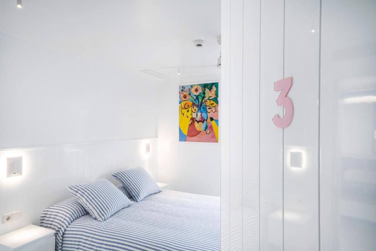 Cama o camas de una habitación en The Pink Elephant Hotel