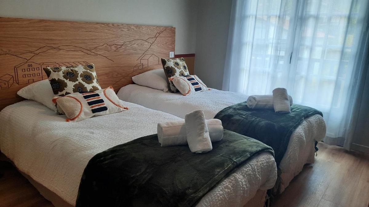 Un ou plusieurs lits dans un hébergement de l'établissement Hotel Trinquet
