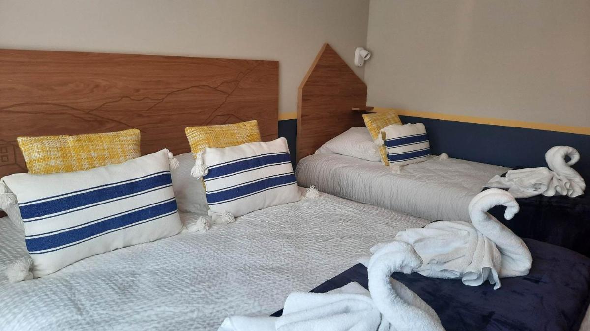Un ou plusieurs lits dans un hébergement de l'établissement Hotel Trinquet