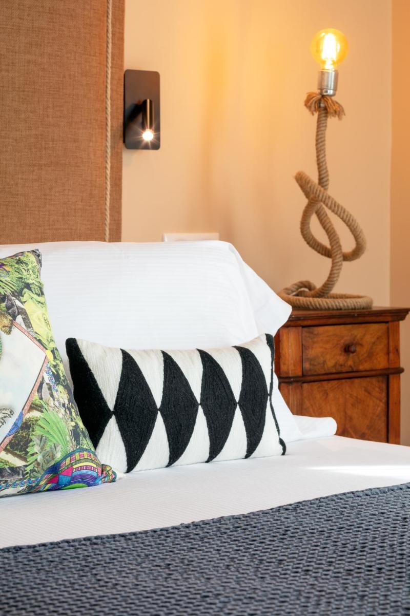 Un ou plusieurs lits dans un hébergement de l'établissement Hôtel La Dimora & Spa