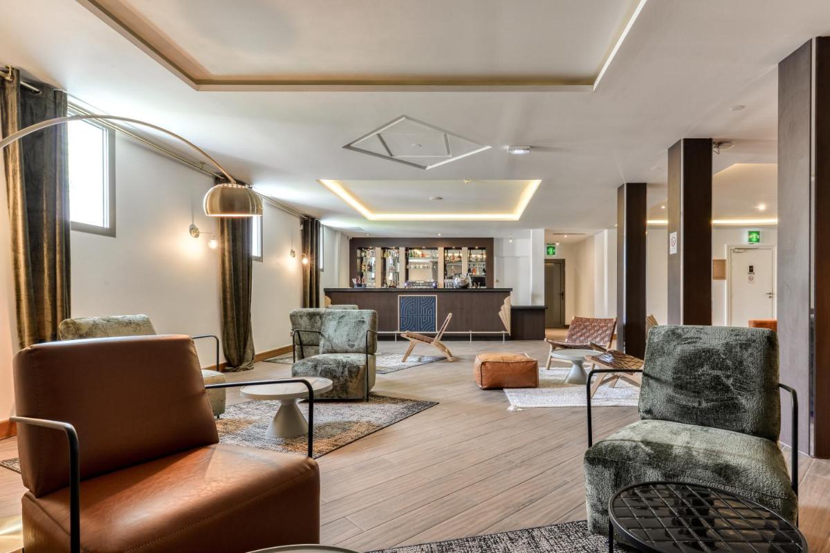 Coin salon dans l'établissement Zenitude Hotel La Valadière, Ascend Hotel Collection
