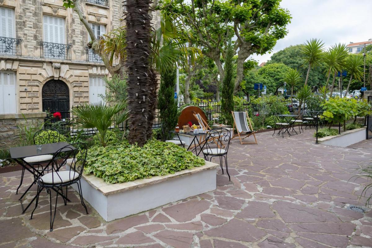 Jardin de l'établissement Hôtel & Espace Bien-être La Maison du Lierre