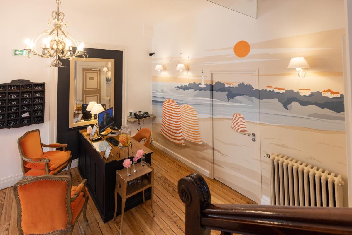 Coin salon dans l'établissement Hôtel & Espace Bien-être La Maison du Lierre