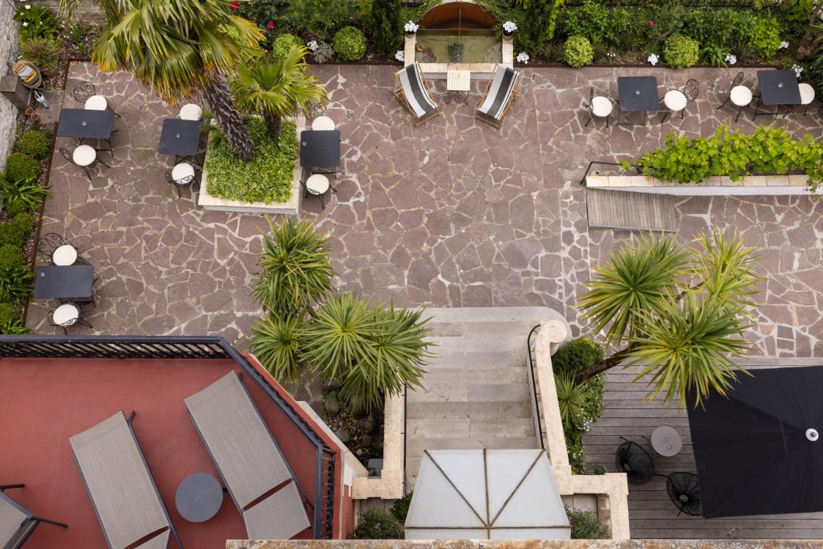 Jardin de l'établissement Hôtel & Espace Bien-être La Maison du Lierre