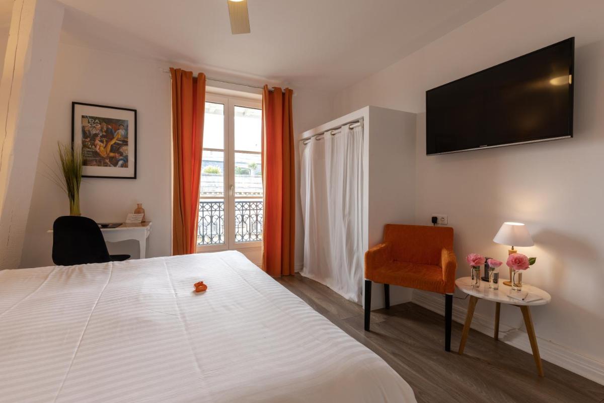 Un ou plusieurs lits dans un hébergement de l'établissement Hôtel & Espace Bien-être La Maison du Lierre