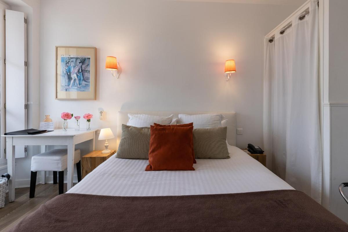 Un ou plusieurs lits dans un hébergement de l'établissement Hôtel & Espace Bien-être La Maison du Lierre
