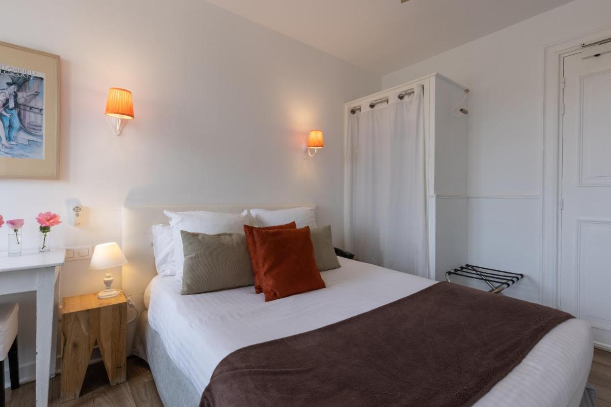 Un ou plusieurs lits dans un hébergement de l'établissement Hôtel & Espace Bien-être La Maison du Lierre