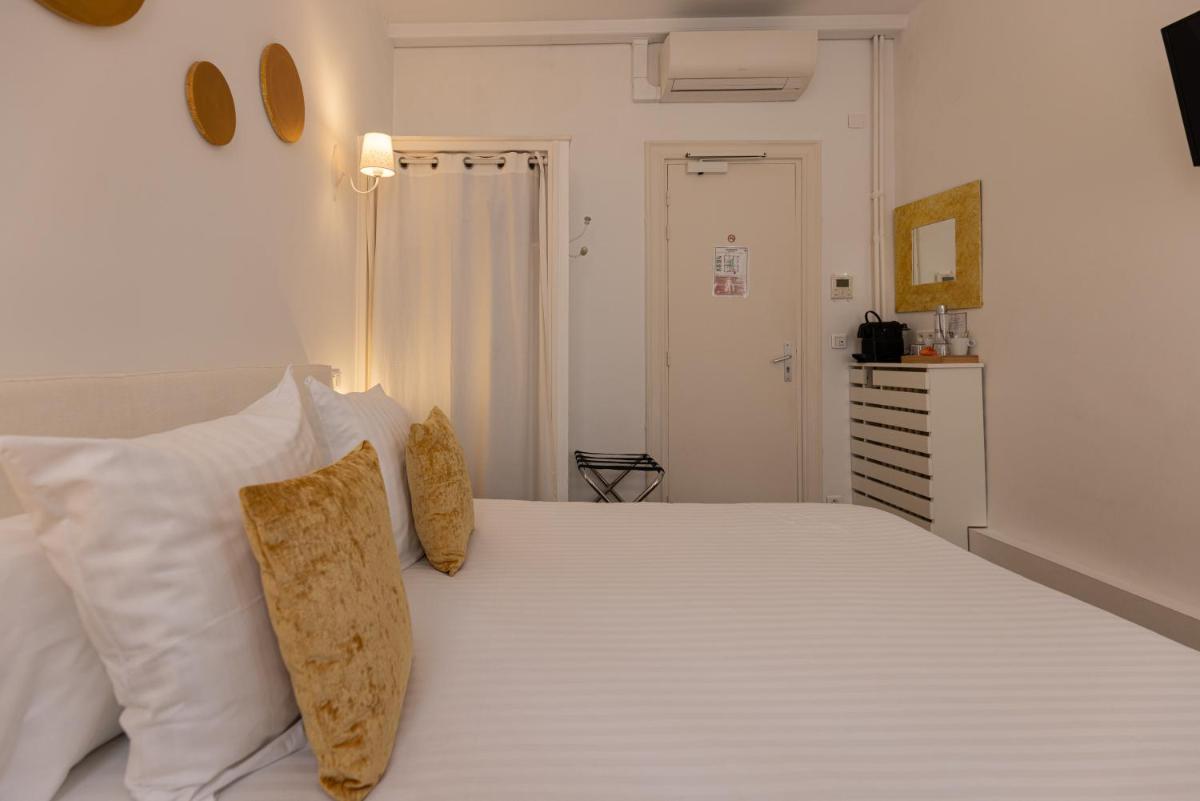 Un ou plusieurs lits dans un hébergement de l'établissement Hôtel & Espace Bien-être La Maison du Lierre