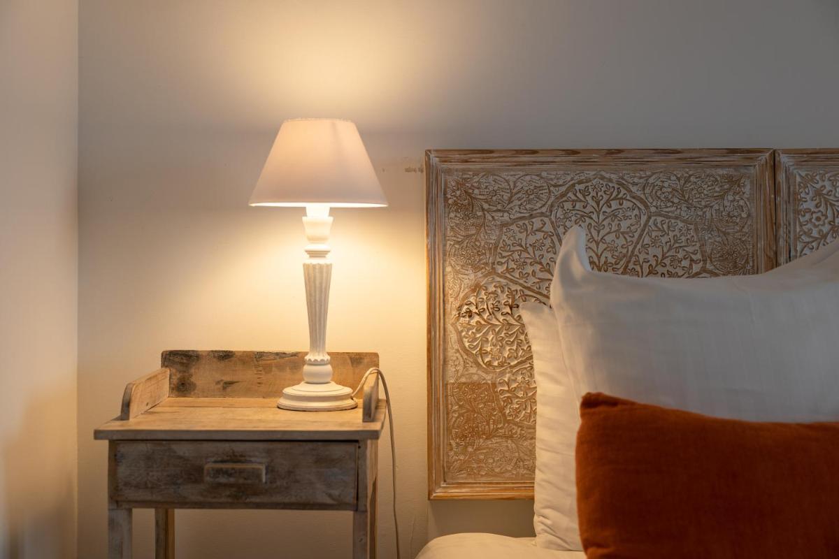 Un ou plusieurs lits dans un hébergement de l'établissement Hôtel & Espace Bien-être La Maison du Lierre