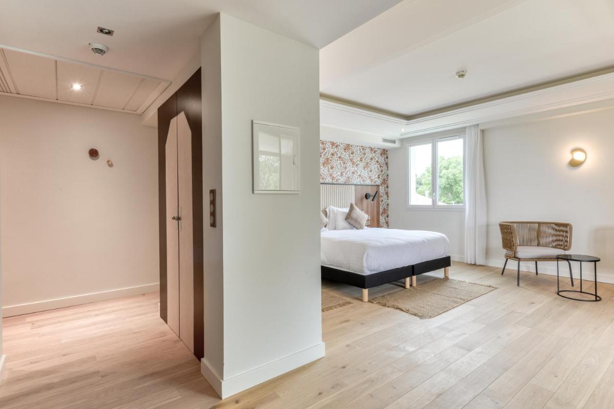 Un ou plusieurs lits dans un hébergement de l'établissement Zenitude Hotel La Valadière, Ascend Hotel Collection