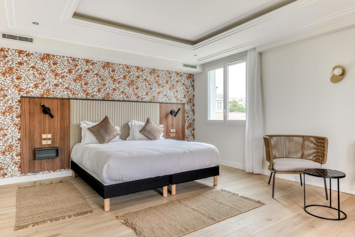 Un ou plusieurs lits dans un hébergement de l'établissement Zenitude Hotel La Valadière, Ascend Hotel Collection