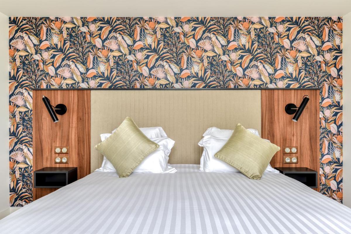 Un ou plusieurs lits dans un hébergement de l'établissement Zenitude Hotel La Valadière, Ascend Hotel Collection