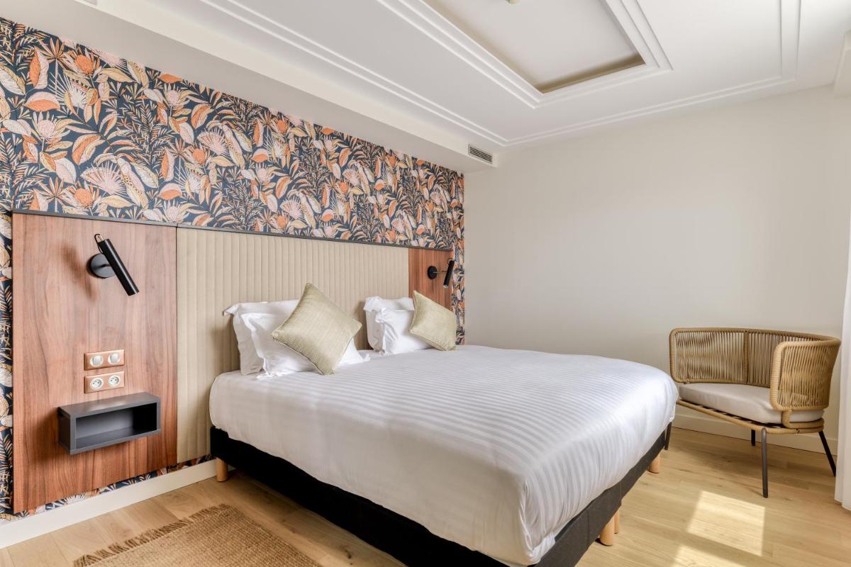 Un ou plusieurs lits dans un hébergement de l'établissement Zenitude Hotel La Valadière, Ascend Hotel Collection