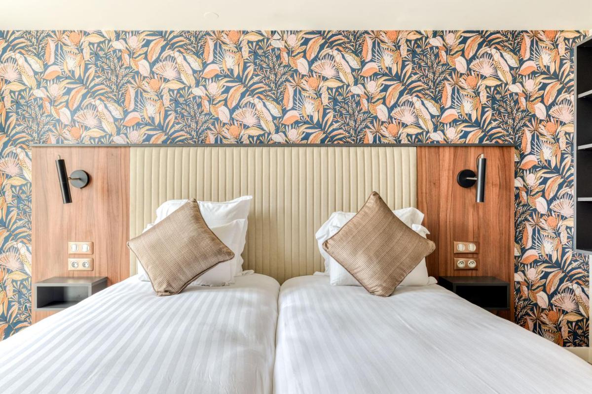 Un ou plusieurs lits dans un hébergement de l'établissement Zenitude Hotel La Valadière, Ascend Hotel Collection