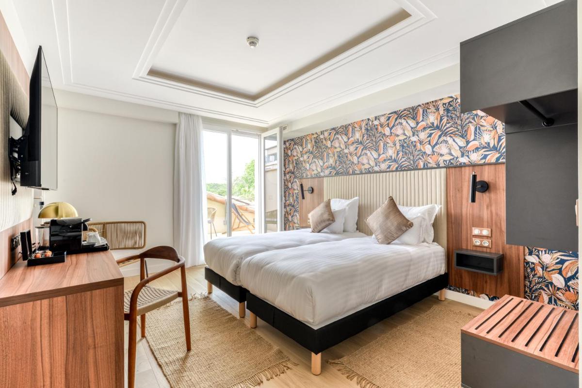 Un ou plusieurs lits dans un hébergement de l'établissement Zenitude Hotel La Valadière, Ascend Hotel Collection