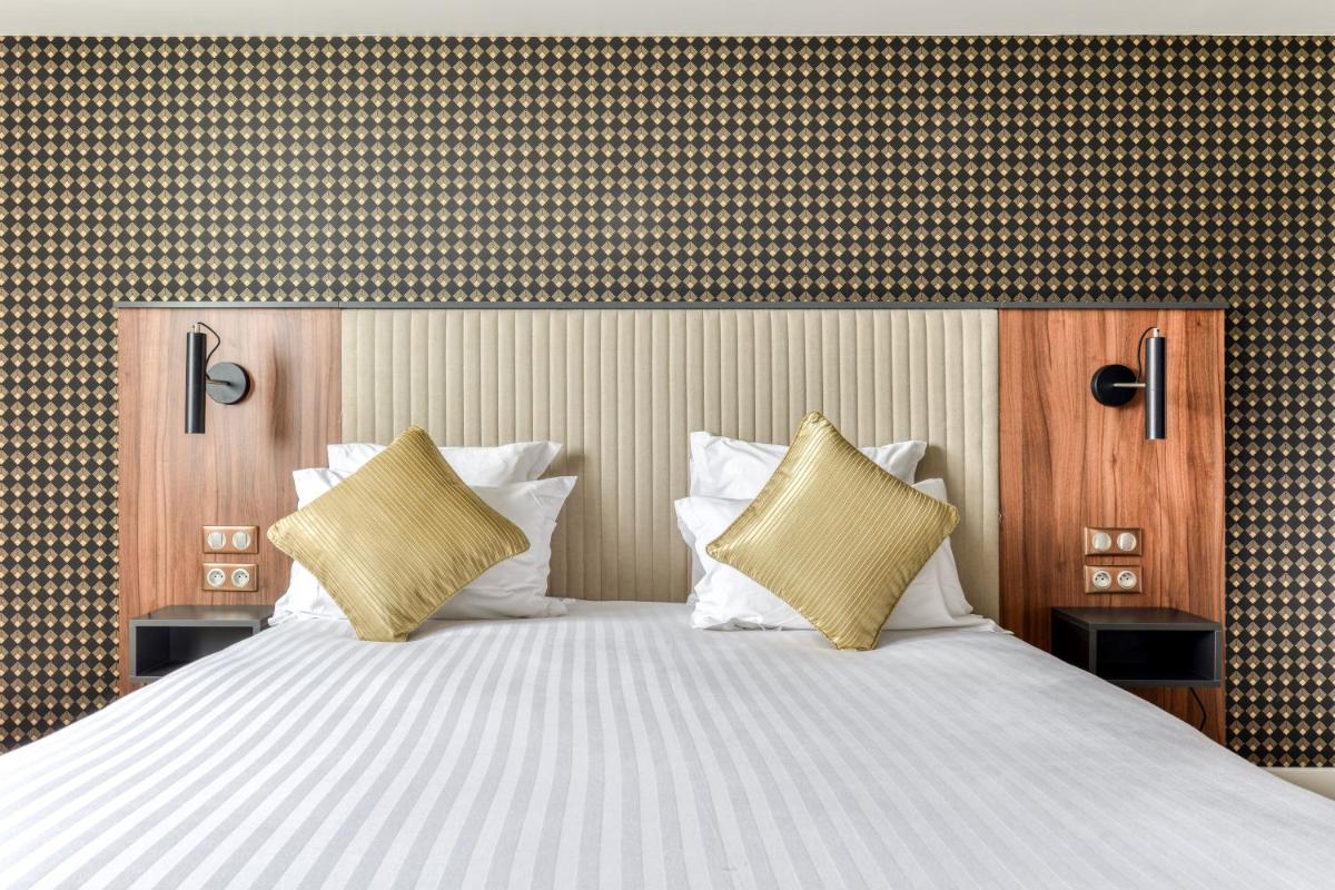 Un ou plusieurs lits dans un hébergement de l'établissement Zenitude Hotel La Valadière, Ascend Hotel Collection