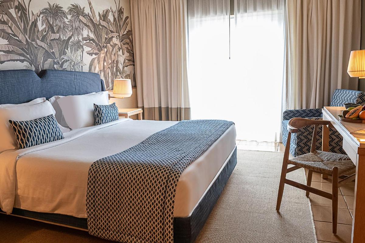 Uma cama ou camas num quarto em Domes Lake Algarve, Autograph Collection