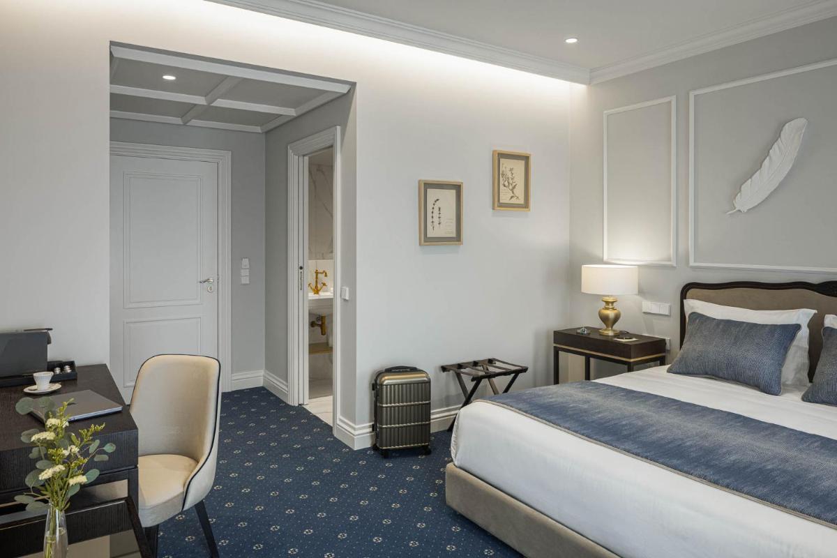 Uma cama ou camas num quarto em MS Collection Aveiro - Palacete Valdemouro