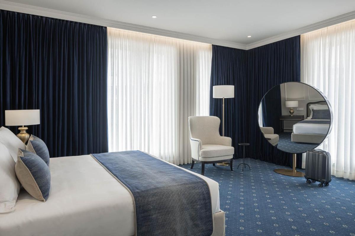 Uma cama ou camas num quarto em MS Collection Aveiro - Palacete Valdemouro