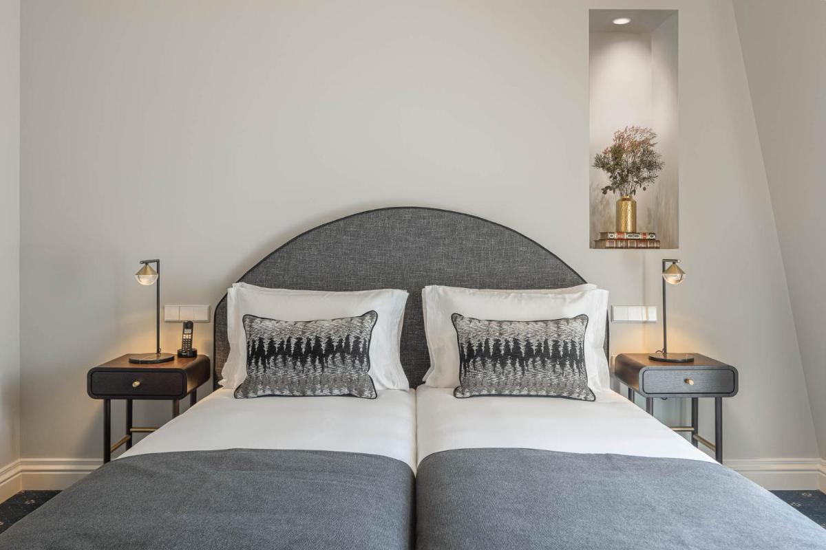 Uma cama ou camas num quarto em MS Collection Aveiro - Palacete Valdemouro