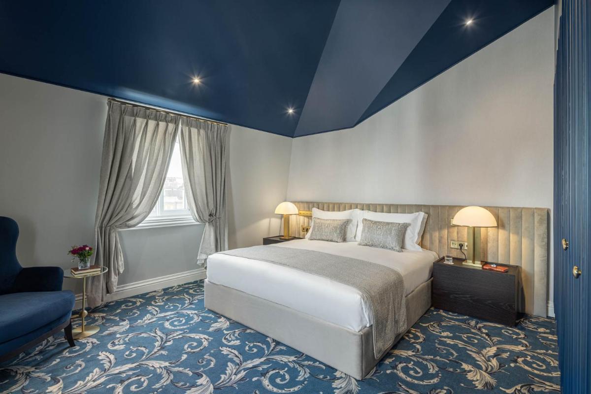 Uma cama ou camas num quarto em MS Collection Aveiro - Palacete Valdemouro