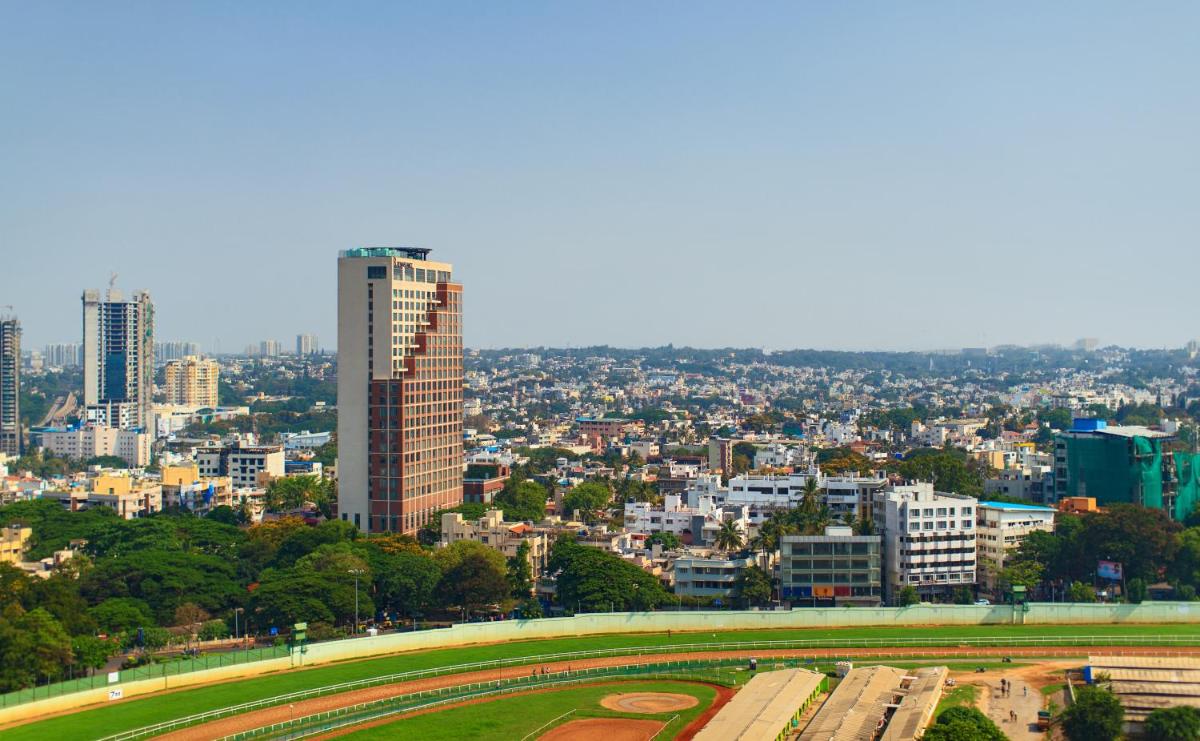 a view of a city with a tall building at Renaissance Bengaluru Race Course Hotel in Bengaluru