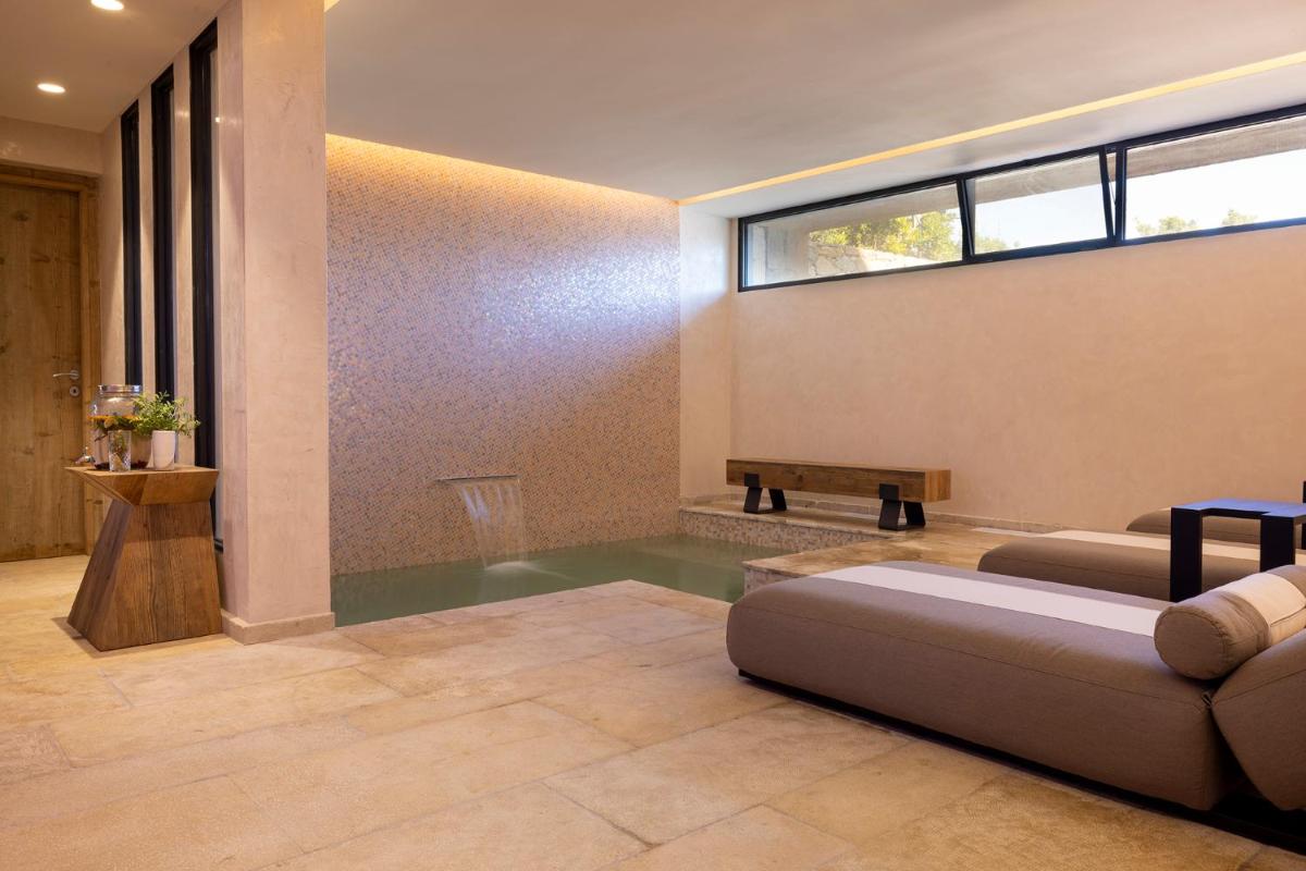 Coin salon dans l'établissement Les Regalia Hôtel & Spa