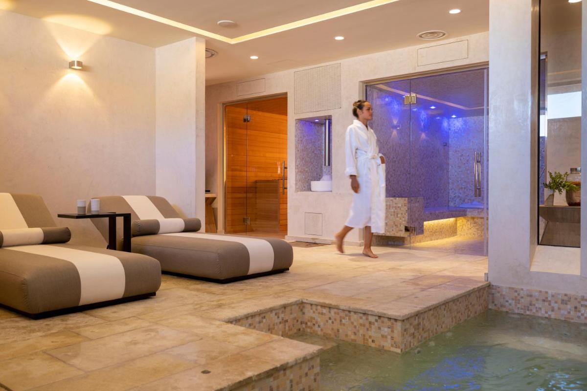 Coin salon dans l'établissement Les Regalia Hôtel & Spa
