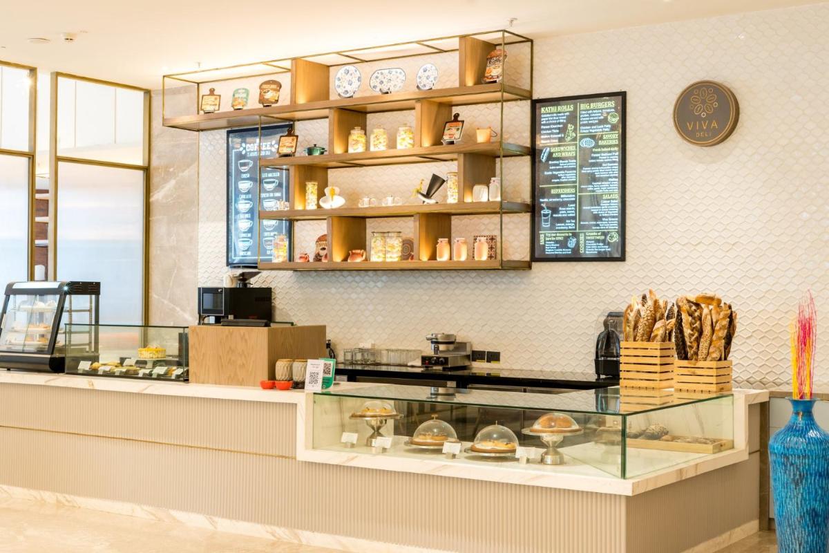 a bakery with a display case in a store at Holiday Inn Lucknow Airport by IHG in Lucknow