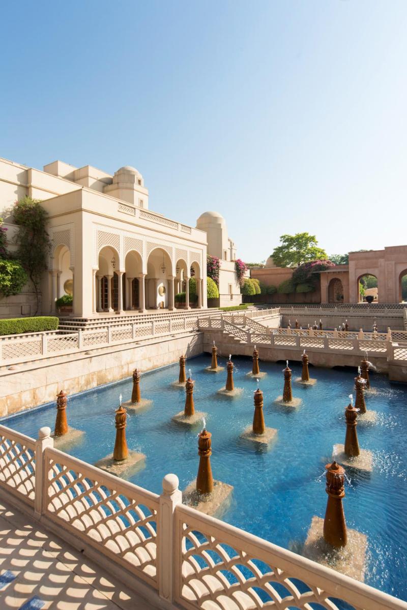 a water fountain in front of a building at The Oberoi Amarvilas Agra in Agra