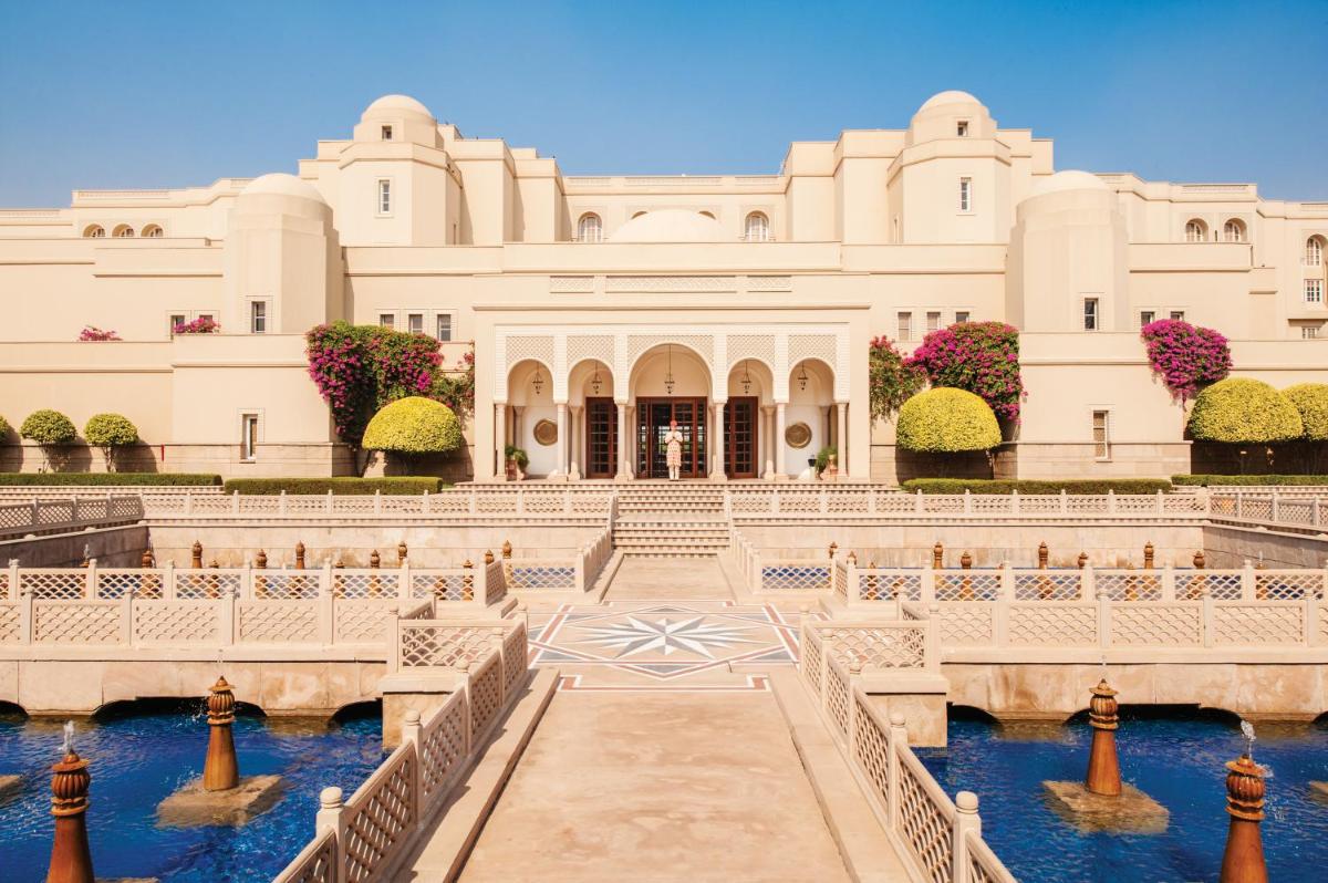 a building with a pool of water in front of it at The Oberoi Amarvilas Agra in Agra